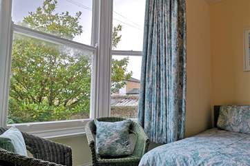 The comfortable second bedroom with twin beds.