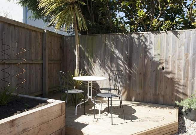 There is a decked-area for al fresco dining in the garden area leading to the front door.