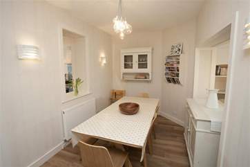 The dining-area has an open hatch from the kitchen.