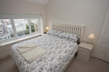 The king-size bed has sea views.