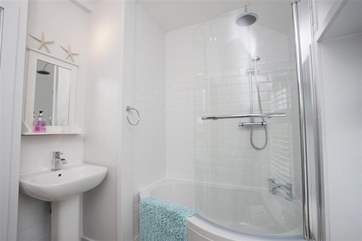 The bathroom with shower overhead.