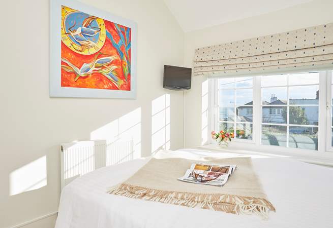 Bedroom one is lovely and bright with the sun shining through the window.  Don't miss the view of the sea!