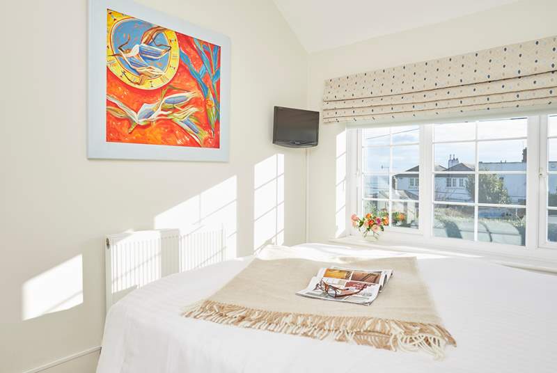 Bedroom one is lovely and bright with the sun shining through the window.  Don't miss the view of the sea!