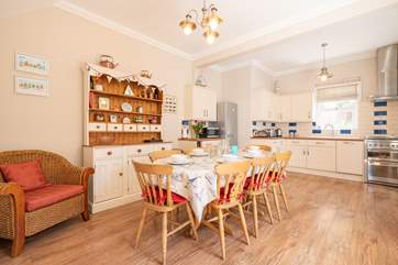 The kitchen/dining room on the ground floor showcases plenty of space for the family to spread out.