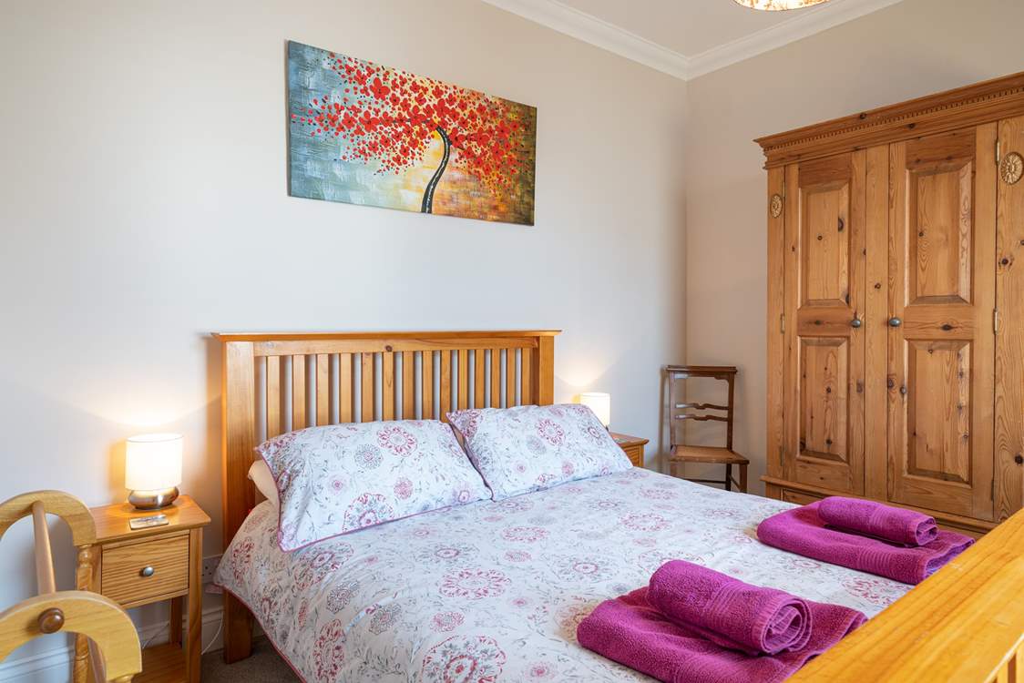 The pretty second bedroom on the first floor.