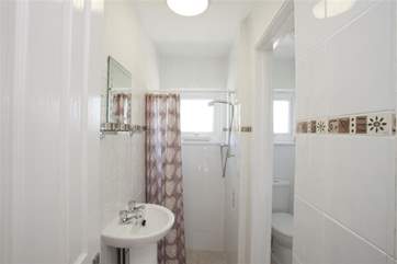 Family shower room with adjacent WC.