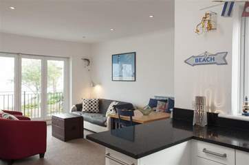 The doors open up to the balcony, letting in plenty of sea air to give you the full seaside experience.