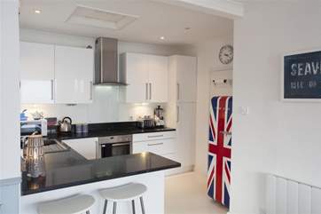 A colourful, quirky addition to the beautiful modern kitchen.
