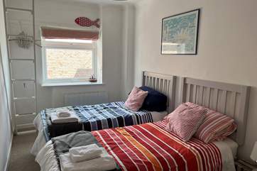 The twin bedroom is lovely and light, the colour scheme flows throughout the setting.