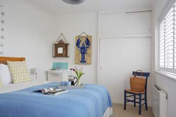 Lovely bedroom 1 with a king size bed has a sea view.