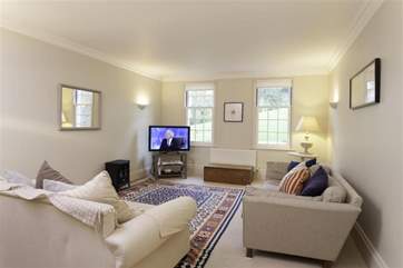 The comfortable sitting-room is perfect for relaxing after a day exploring the Island.