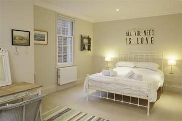The bright, spacious master bedroom has an en suite shower-room.