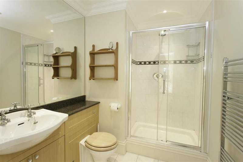 One of two contemporary bath/shower rooms.