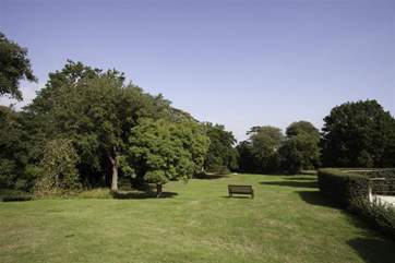 This gated residence offers inviting outdoor space, perfect for quiet contemplation.