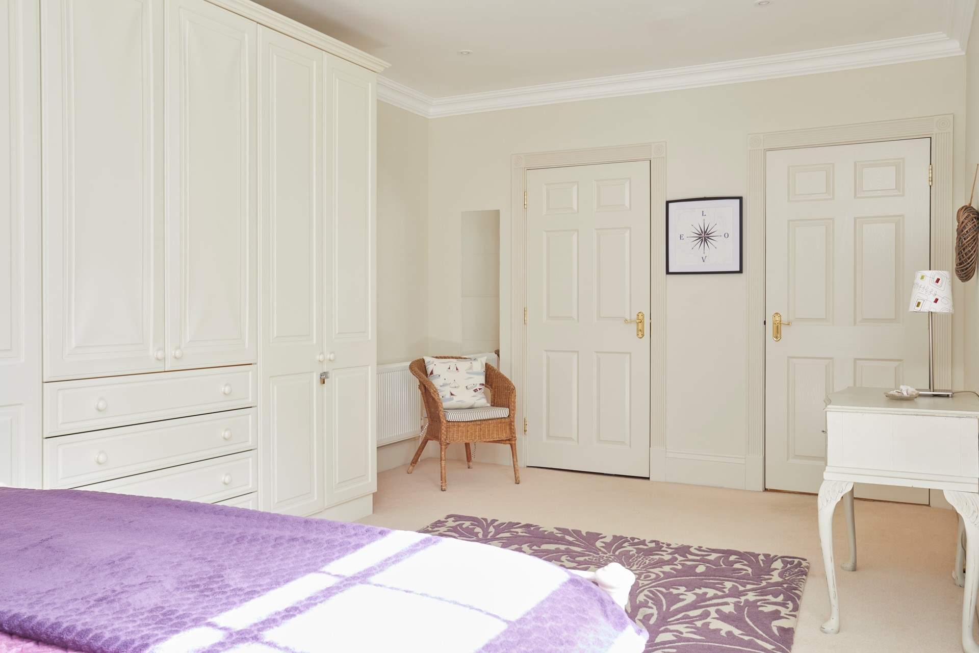 This bedroom has an en suite shower-room through the door on the left.
