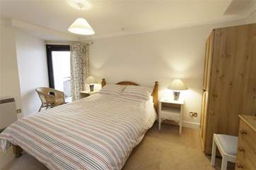The master bedroom has a balcony and en suite bathroom.