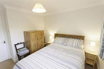 The second double bedroom is bright and comfortable.
