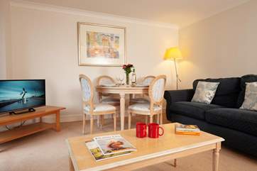 The table and chairs in the sitting-room are the perfect spot for games nights and casual family meals.