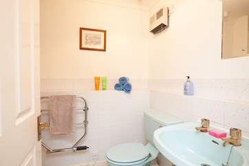 The first floor family bathroom, includes a shower cubicle.