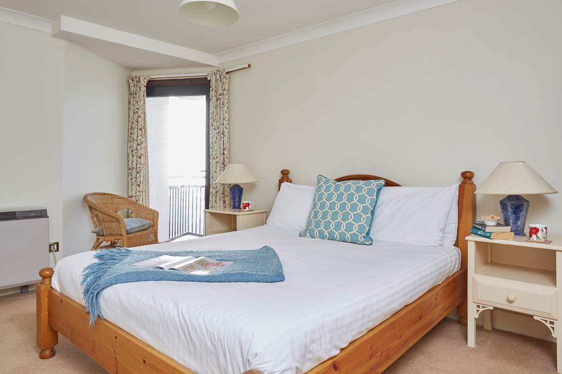 The main bedroom has a balcony and en suite bathroom.