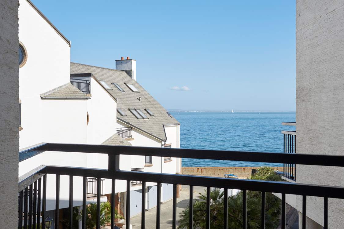 The delightful view of the sea from the bedroom balcony.