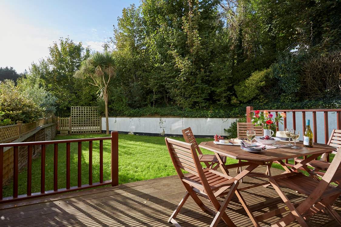 The lovely private patio leading off the sitting-room with an enclosed private rear garden.