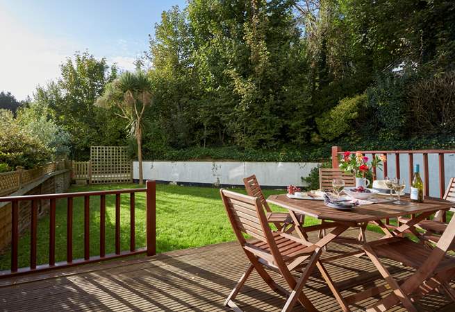 The lovely private patio leading off the sitting-room with an enclosed private rear garden.