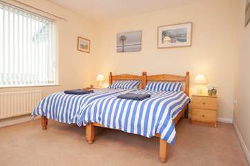 The master bedroom on the ground floor boasts sea views.