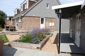 The flowers are a lovely touch to the beautiful garden.