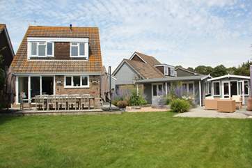 The garden has been thoughtfully landscaped to provide a wonderful outdoor dining-area.