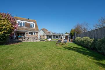 The garden has been thoughtfully landscaped to provide a wonderful outdoor dining-area.