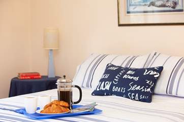 Enjoy a light breakfast in bed before an active day at the beach.
