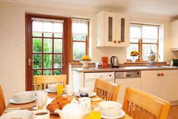 The dining-area is a pleasant place for the family to gather for meals and to plan the day's activities.