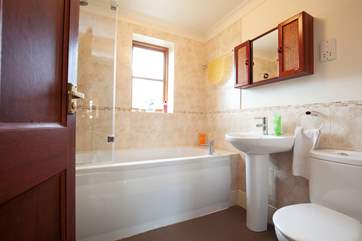 There is a modern family bathroom on the first floor.