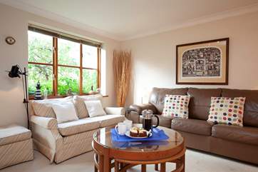 The sitting-area is bright and comfortable, with plenty of space for the entire family.