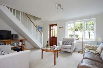 The beautifully decorated sitting-room is spacious and light. The ground floor is open plan with kitchen and dining areas.