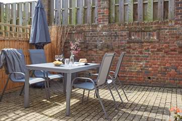 The rear courtyard is perfect for al fresco dining.
