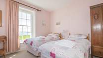 The twin bedroom on first floor with sea views.