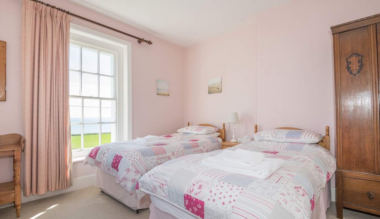 The twin bedroom on first floor with sea views.