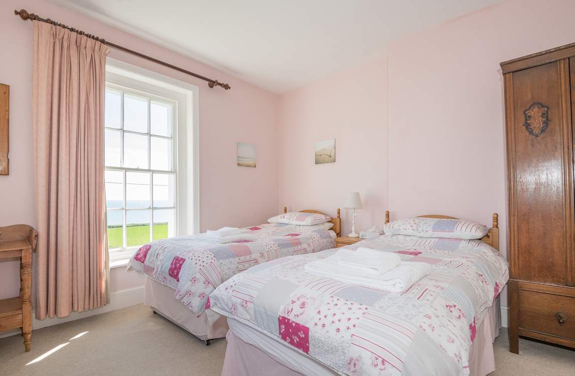 The twin bedroom on first floor with sea views.