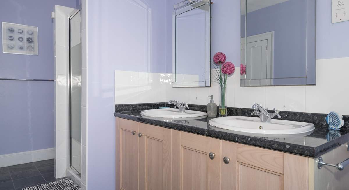 The family bathroom with bath and large walk-in shower cubicle.