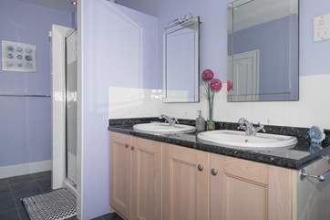 The family bathroom with bath and large walk-in shower cubicle.