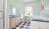 The bathroom is spacious and full of natural light. - Thumbnail Image
