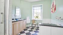 The bathroom is spacious and full of natural light.