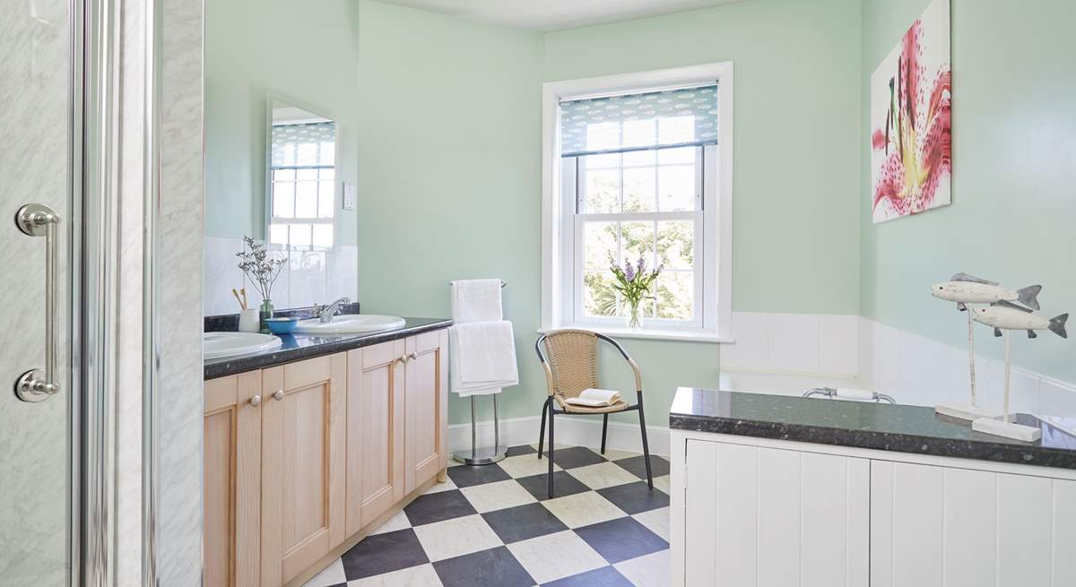 The bathroom is spacious and full of natural light.