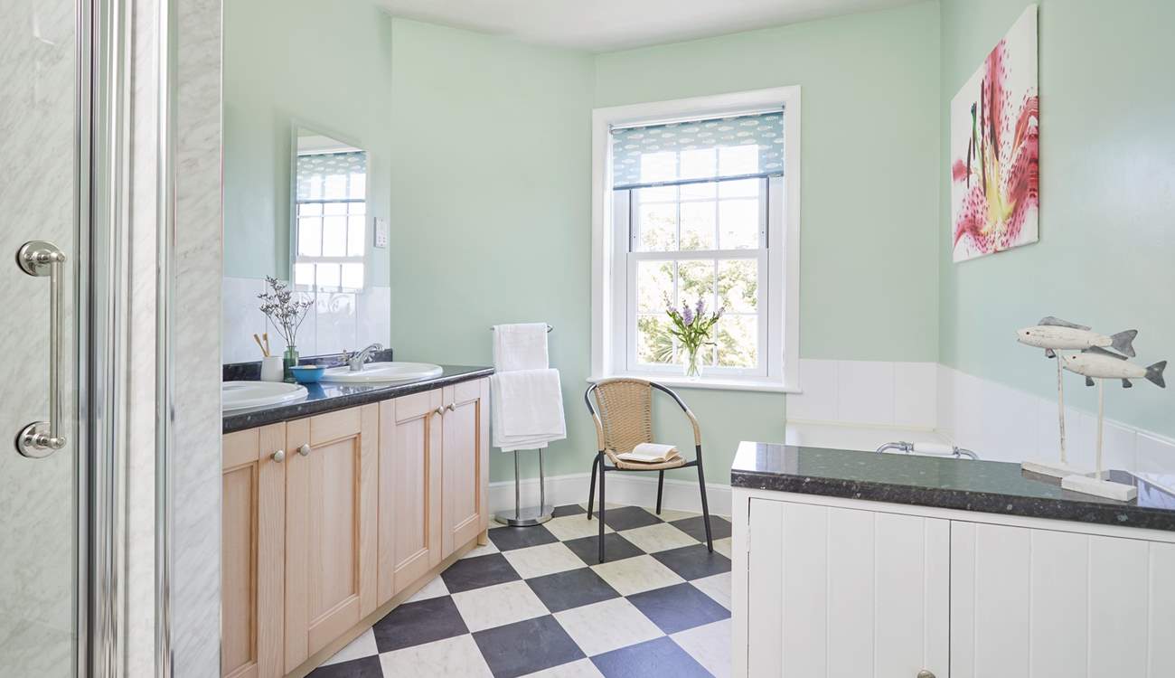 The bathroom is spacious and full of natural light.