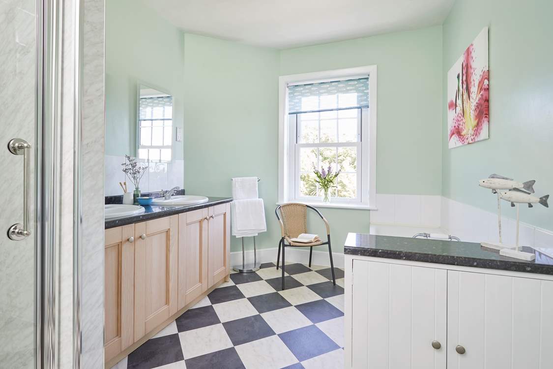 The bathroom is spacious and full of natural light.