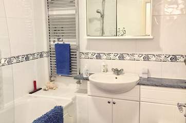 Family bathroom with shower over the bath.