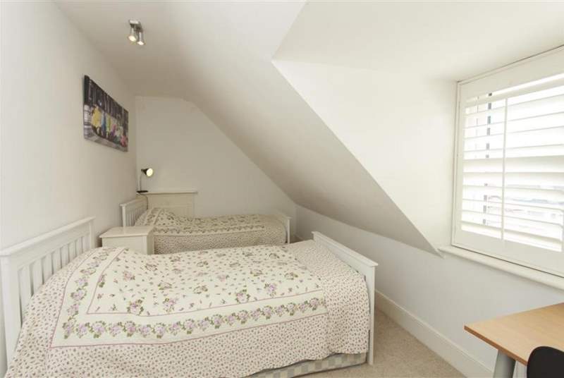 The double bedroom in the eaves on the second floor is cosy and bright.