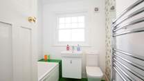 One of two modern bath/shower-rooms.